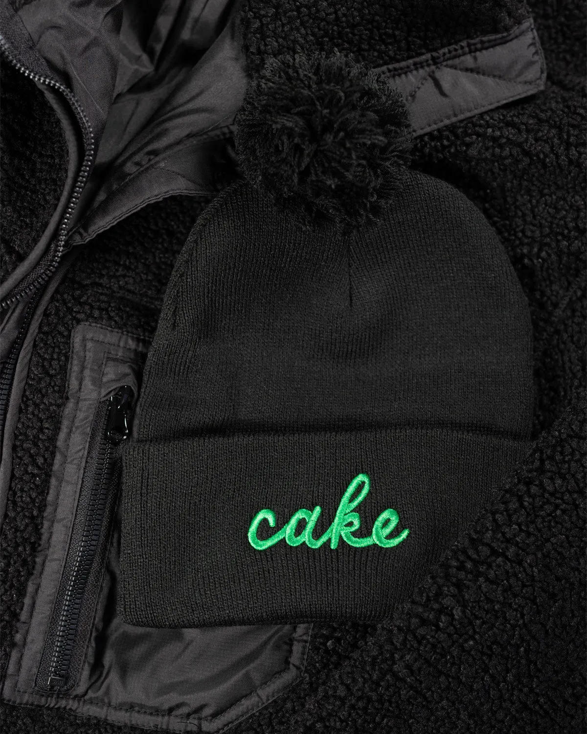 Northmade Co. Edina "Cake" Pom Hat in Black/Green
